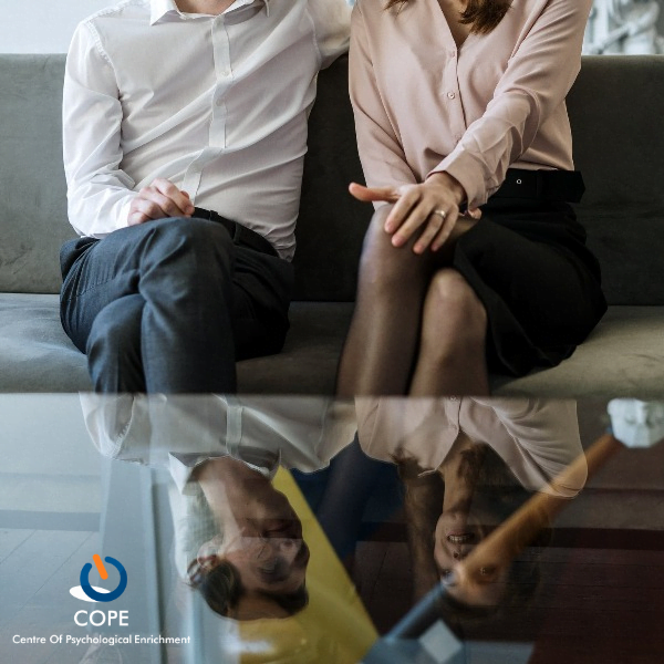 couple sitting on a couch for couples therapy
